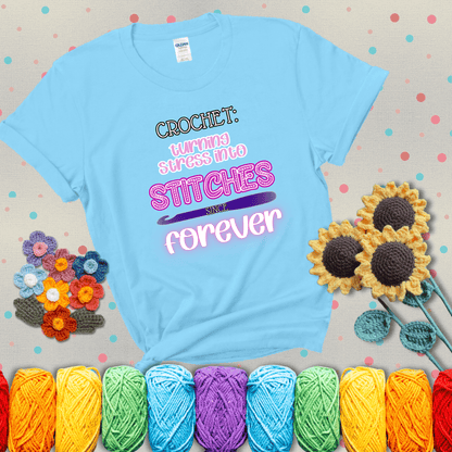 When life gets tangled, we stitch it out Design reads 'Crochet: Turning Stress Into Stitches Since Forever' , perfect crochet gift for yarn lovers; showing a light blue tee with grey sunflower background