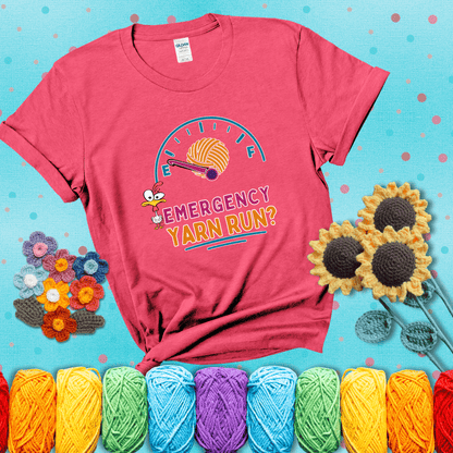 A fuel gauge with a ball of yarn as the needle pointing to empty, a frantic chicken, and the text “Emergency Yarn Run?” showing a light red tee with a teal sunflower background