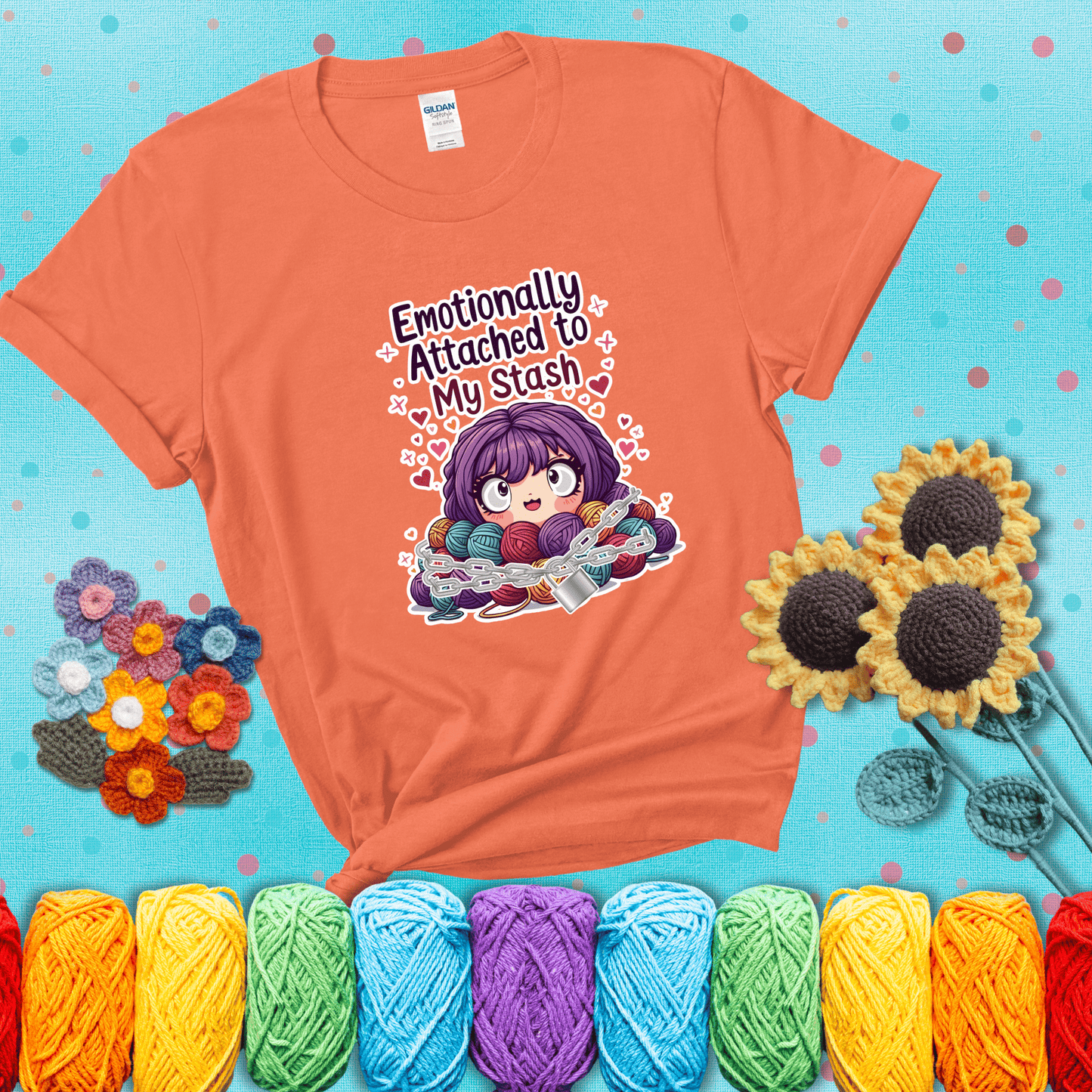 Rows of colorful yarn skeins stacked with playful text. Text reads: “Emotionally Attached to My Stash.” A humorous shirt for fiber lovers with growing collections, showing a light orange tee with a teal sunflower background