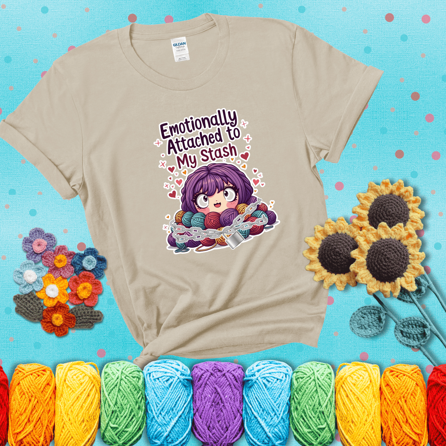 Rows of colorful yarn skeins stacked with playful text. Text reads: “Emotionally Attached to My Stash.” A humorous shirt for fiber lovers with growing collections, showing a beige tee with a teal sunflower background