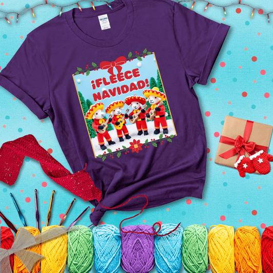 Four crocheted sheep dressed in red mariachi outfits with guitars, standing in a snowy scene under the phrase “¡Fleece Navidad!” showing a purple tee with a festive Christmas background