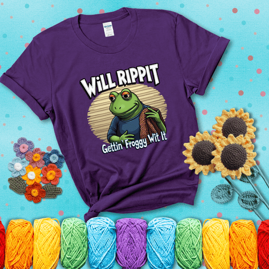 Cool frog with sunglasses, surrounded by yarn and hooks. Text reads: “Gettin’ Froggy Wit It.” A hip and humorous crochet tee for yarn lovers with rhythm, showing a purple tee with a teal sunflower background