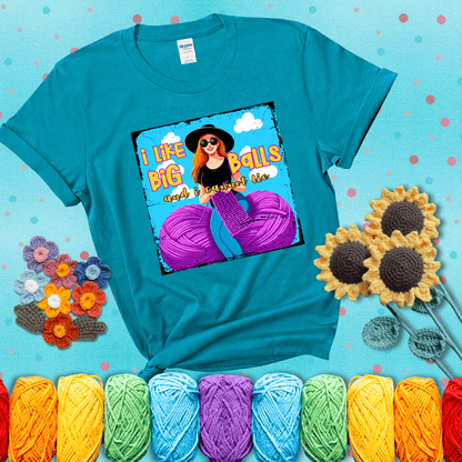 Bold cartoon image of a woman crocheting between two giant purple yarn balls with the phrase “I like big balls and I cannot lie” in retro fonts showing a blue-green tee with a teal sunflower background