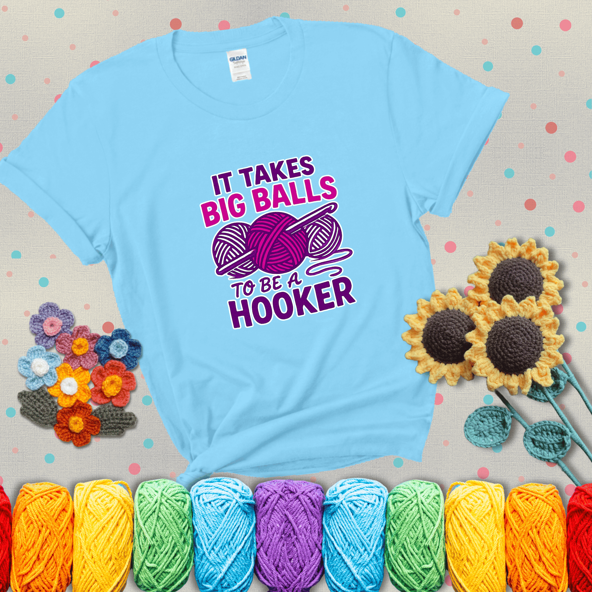 Bigger yarn, bolder energy Design reads 'It Takes Big Balls To Be A Hooker' , perfect crochet gift for yarn lovers showing a light blue tee with grey sunflower background
