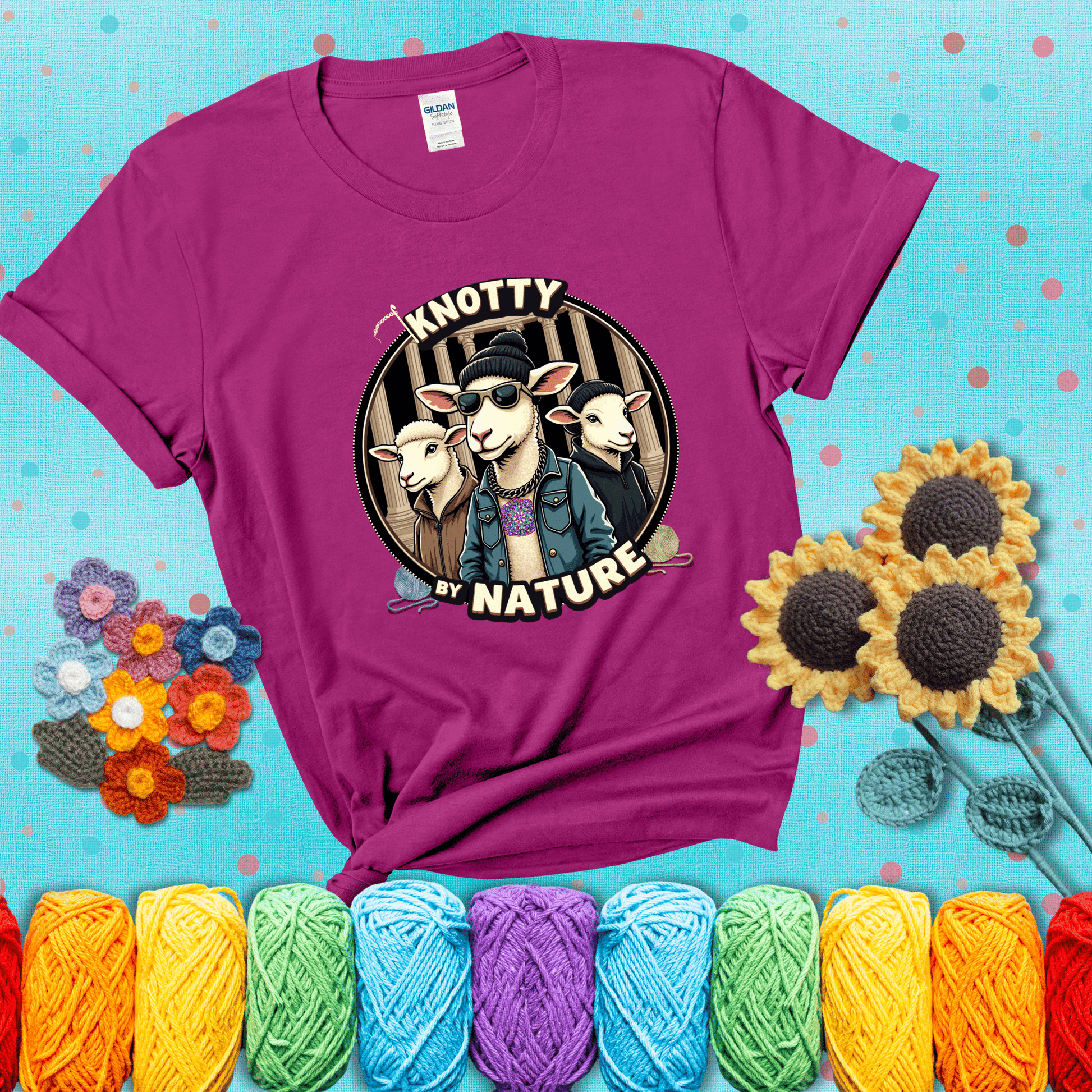 Three cool sheep dressed in urban streetwear pose in front of columns, with bold text “Knotty By Nature,” a hilarious crochet parody with swagger showing a magenta tee with a teal sunflower background