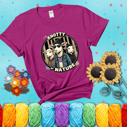 Three cool sheep dressed in urban streetwear pose in front of columns, with bold text “Knotty By Nature,” a hilarious crochet parody with swagger showing a magenta tee with a teal sunflower background