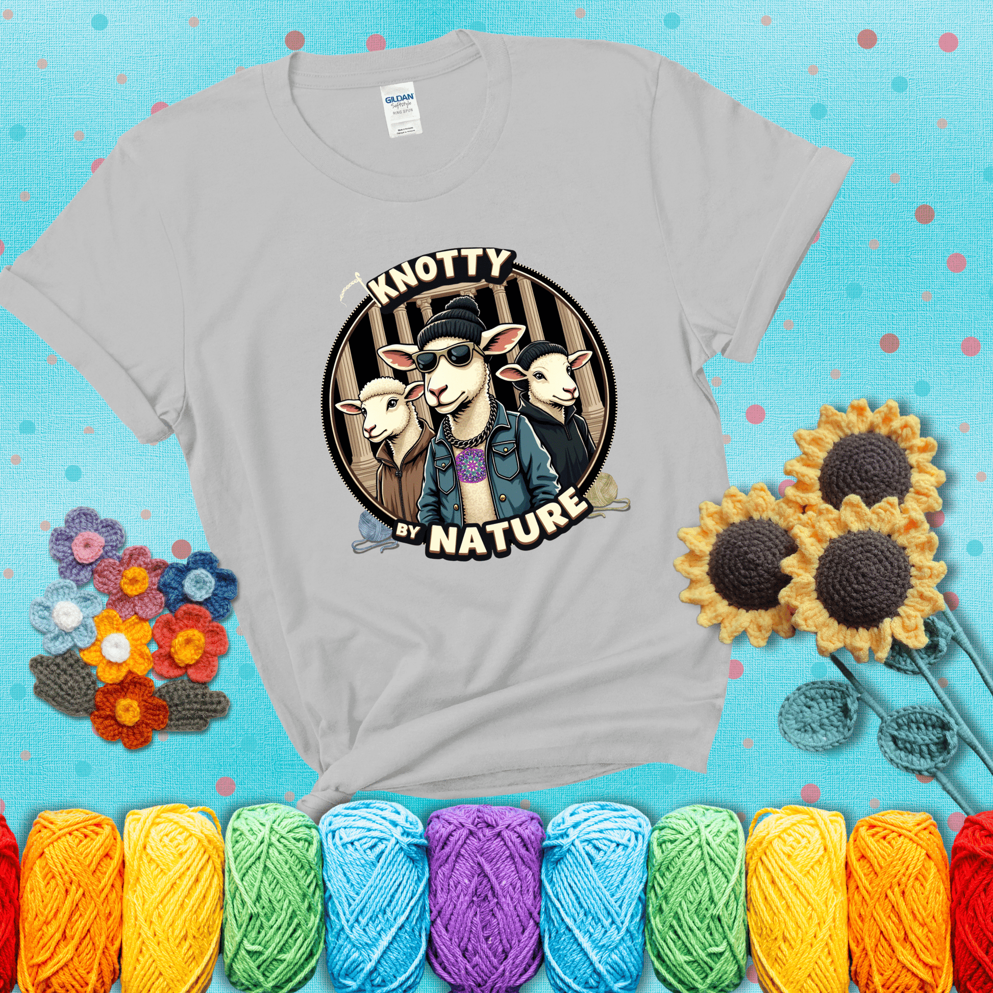 Three cool sheep dressed in urban streetwear pose in front of columns, with bold text “Knotty By Nature,” a hilarious crochet parody with swagger showing a light grey tee with a teal sunflower background
