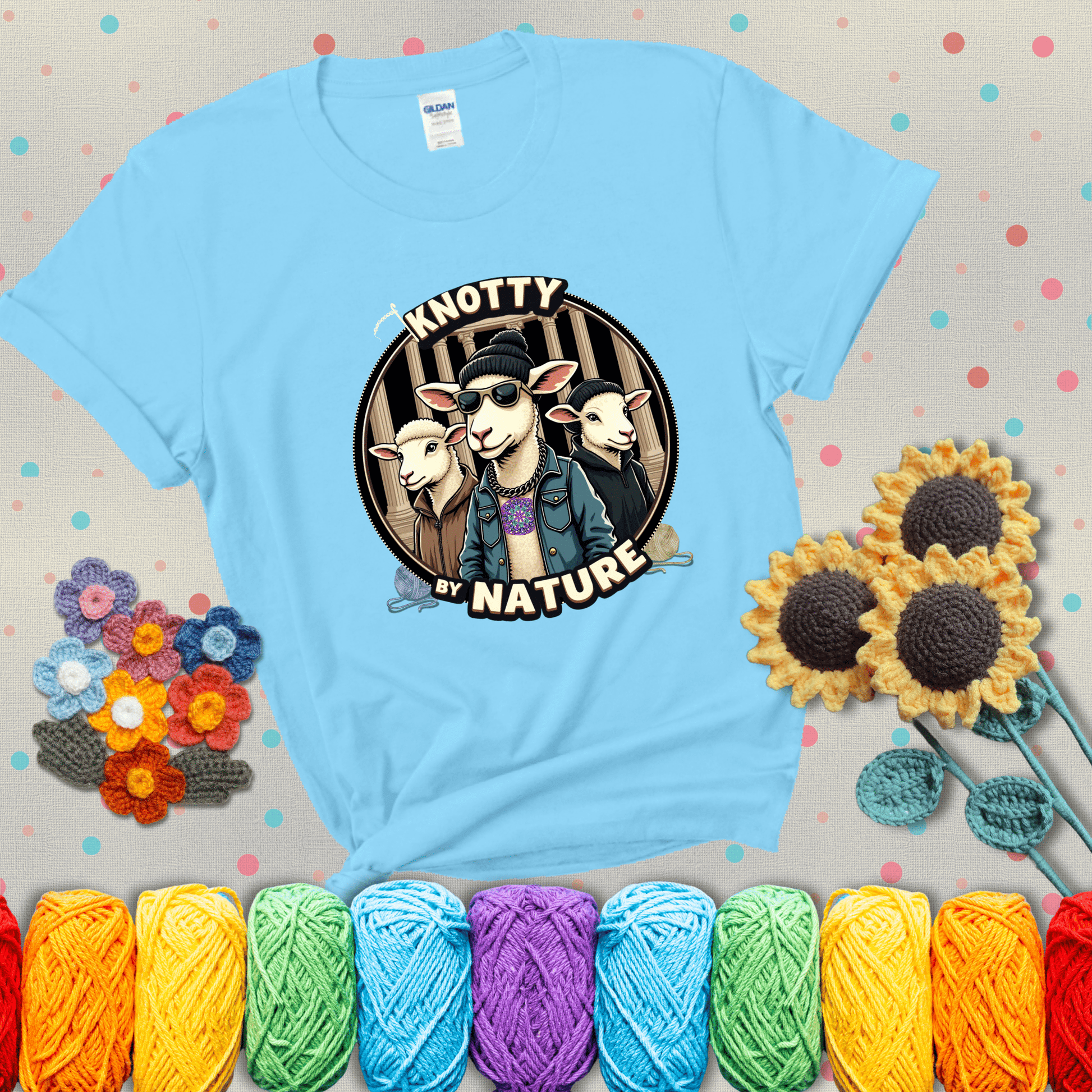 Three cool sheep dressed in urban streetwear pose in front of columns, with bold text “Knotty By Nature,” a hilarious crochet parody with swagger showing a light blue tee with grey sunflower background