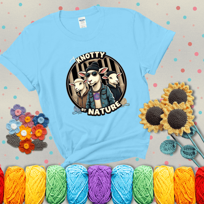 Three cool sheep dressed in urban streetwear pose in front of columns, with bold text “Knotty By Nature,” a hilarious crochet parody with swagger showing a light blue tee with grey sunflower background