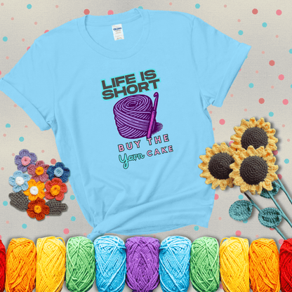 No regrets, just yarn Design reads 'Life Is Short. Buy The Yarn (Cake)' , perfect crochet gift for yarn lovers, showing a light blue tee with grey sunflower background