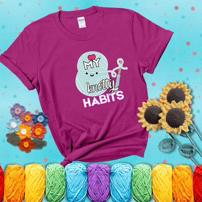 Smiling yarn ball and hook with text “Love My Knotty Habits” - cute crochet shirt with playful design for makers, showing a magenta tee with a teal sunflower background