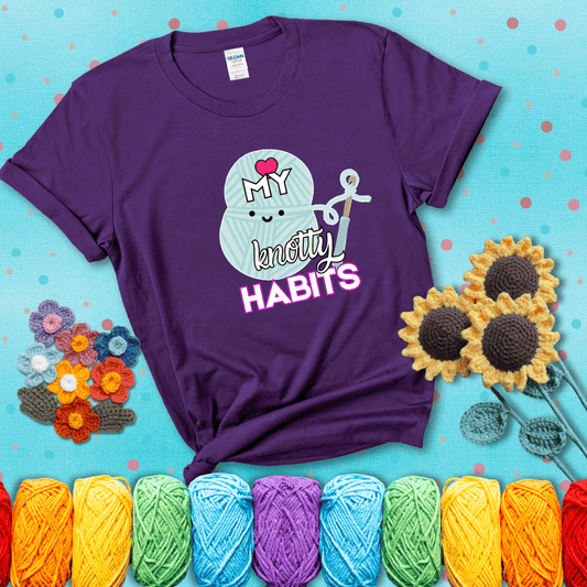 Smiling yarn ball and hook with text “Love My Knotty Habits” - cute crochet shirt with playful design for makers, showing a purple tee with a teal sunflower background