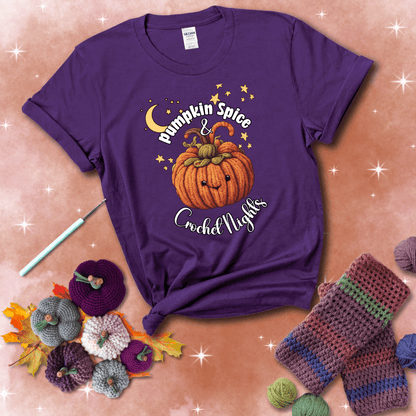 Smiling pumpkin crocheted with yarn texture, surrounded by stars and a crescent moon. Text reads “Pumpkin Spice & Crochet Nights” showing a purple tee with a festive Fall background