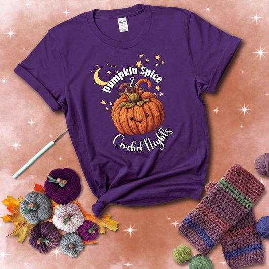 Smiling pumpkin crocheted with yarn texture, surrounded by stars and a crescent moon. Text reads “Pumpkin Spice & Crochet Nights” showing a purple tee with a festive Fall background