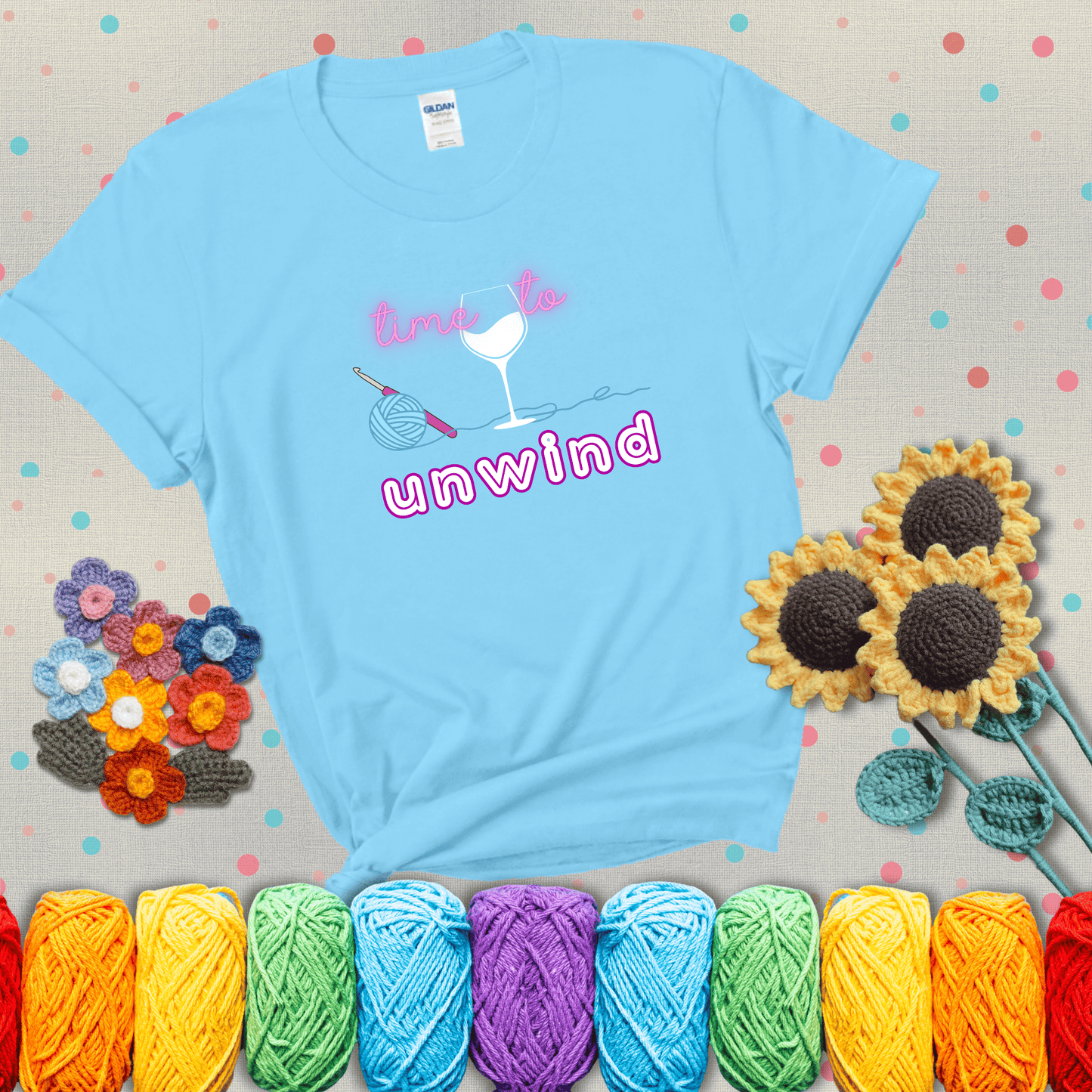 Wine down with your yarn out Design reads 'Time To Unwind' , perfect crochet gift for yarn lovers showing a light blue tee with grey sunflower background