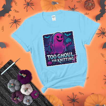 A spooky ghost holds a yarn ball and crochet hook in a vibrant Halloween palette with bats, tombstones, and pumpkins wearing a light blue tee with a festive halloween background