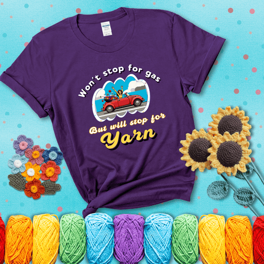 Woman joyfully driving a red convertible overflowing with yarn balls, paired with bold retro lettering and a playful slogan showing a purple tee with a teal sunflower background