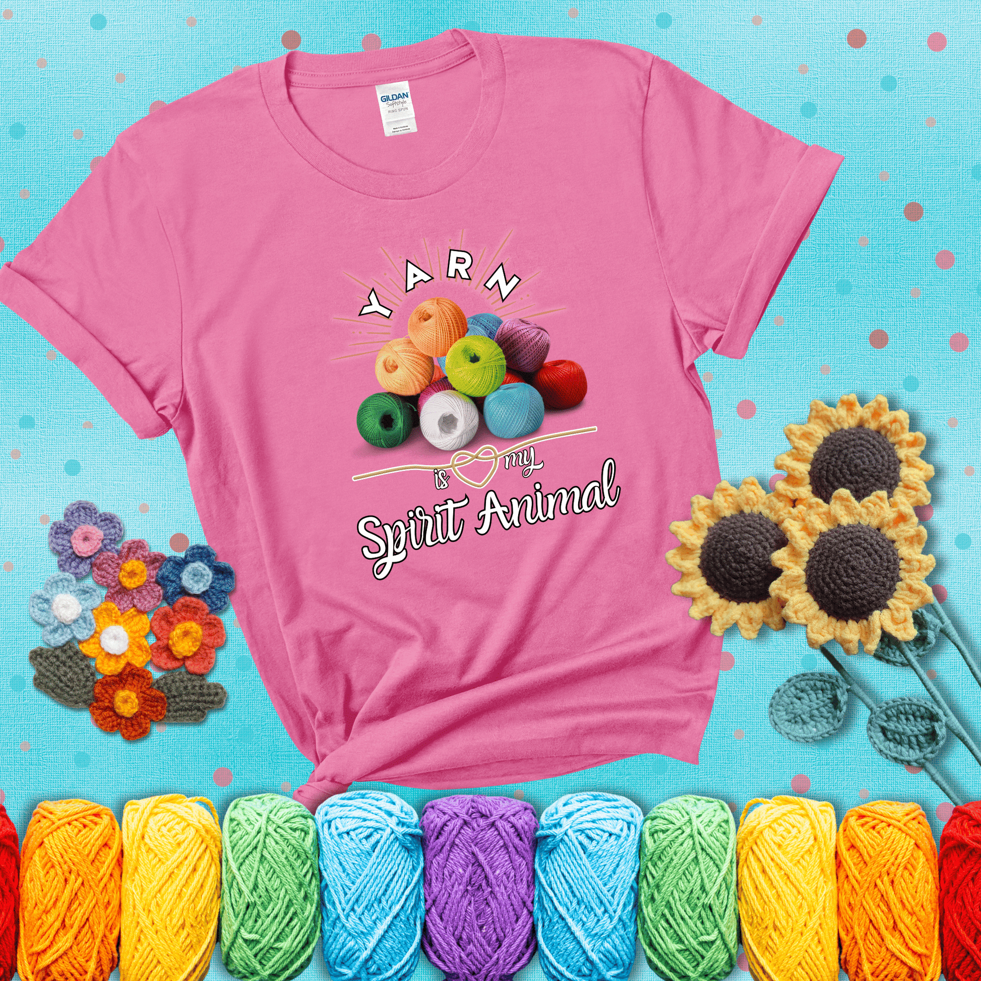 Stack of colorful yarn balls with radiant glow. Text reads: “Yarn Is My Spirit Animal.” A calming and colorful tee for fiber lovers who find zen in stitching, showing a pink tee with a teal sunflower background